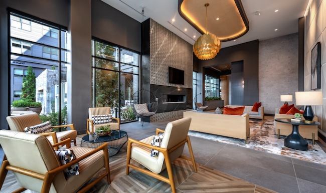 Resident lounge with seating and fireplace